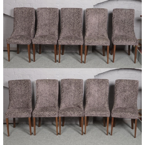 663 - A set of 10 Carlick upholstered in velvet dining chairs and raised on square tapering supports.