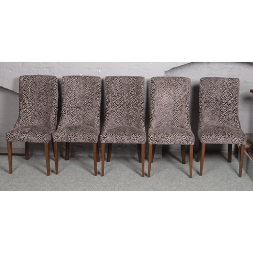 663 - A set of 10 Carlick upholstered in velvet dining chairs and raised on square tapering supports.