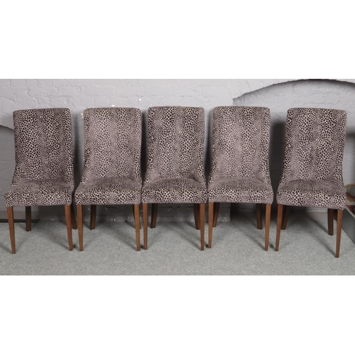 663 - A set of 10 Carlick upholstered in velvet dining chairs and raised on square tapering supports.