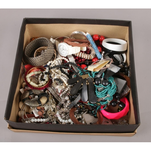 103 - A box of costume jewellery, bangles, beads, quartz wristwatches etc