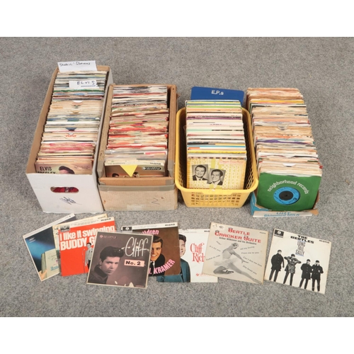 304 - Four boxes of single records and EPs, to include Elvis, The Beatles, The Shadows etc.