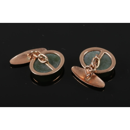 408 - A pair of 9ct gold mounted oval nephrite cufflinks.