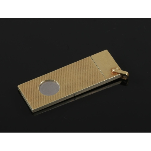 412 - *Correction Of Weight In Description* A 14ct gold cased steel cigar cutter. With reeded case and sus... 