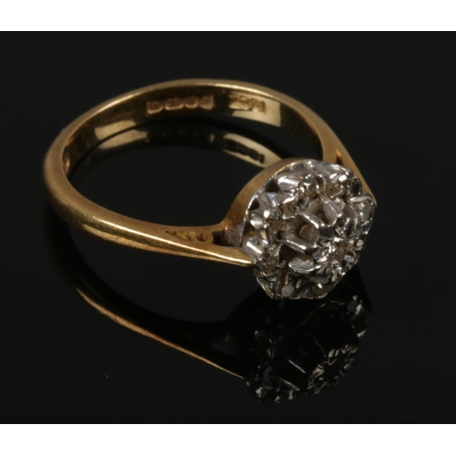 443 - A 18ct gold diamond cluster ring, size M.