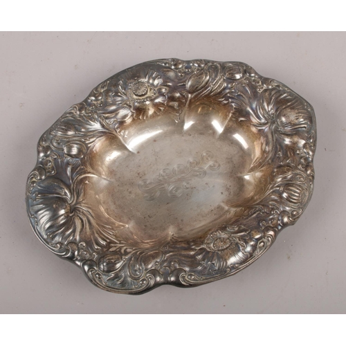 543 - An American sterling silver dish, with floral repousse decoration, by R Wallace & Sons, Connecticut.... 