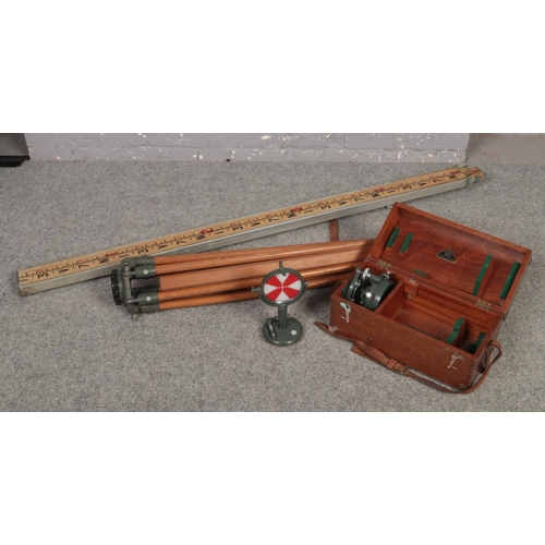 605 - A collection of Hilger & Watts surveyors equipment, to include target, theodolite tripod stand and t... 