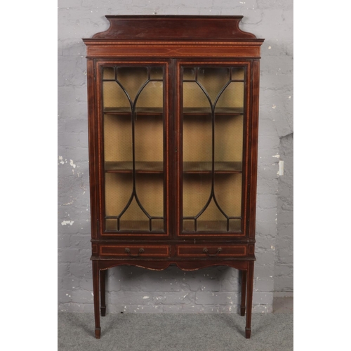 662 - A Victorian mahogany inlaid display cabinet with two drawer base.