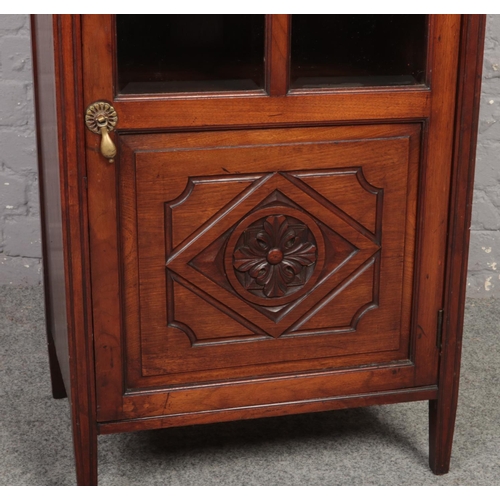 670 - A Victorian mahogany music cabinet. With mirror back painted with water lilies, astragal glazed door... 