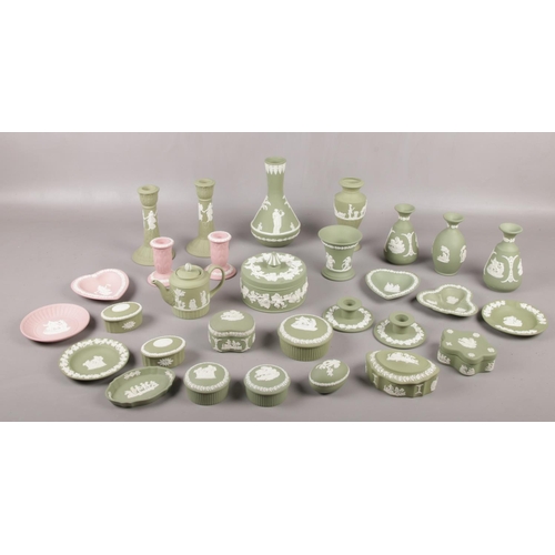 93 - A collection of Wedgwood Green & Pink Jasperware, pair of candlesticks, bud vases, trinkets, pin dis... 