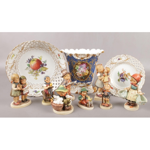 95 - A collection of Goebel Hummel figures, along with two Meissen hand painted cabinet plates and a Cont... 