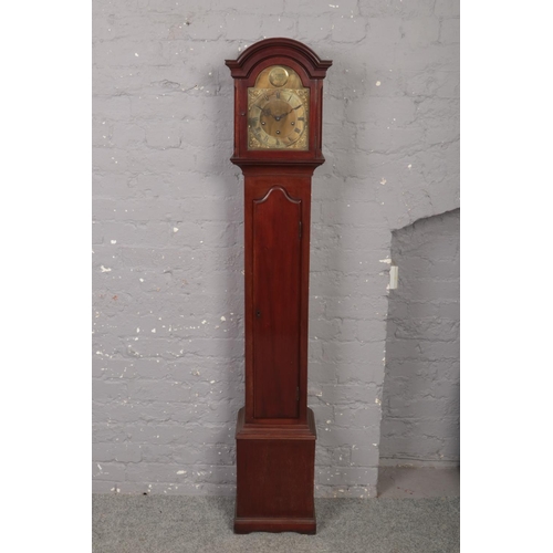 673 - A George V mahogany cased Grandmother clock. With brass arch top and 8 day three train movement stri... 