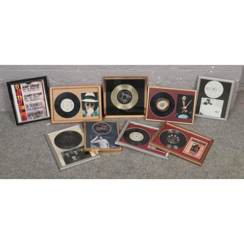 615 - A box of framed 45 rpm, The Beatles 'we can work it out', John Lennon 'Woman' , Ringo Starr ' Only Y... 