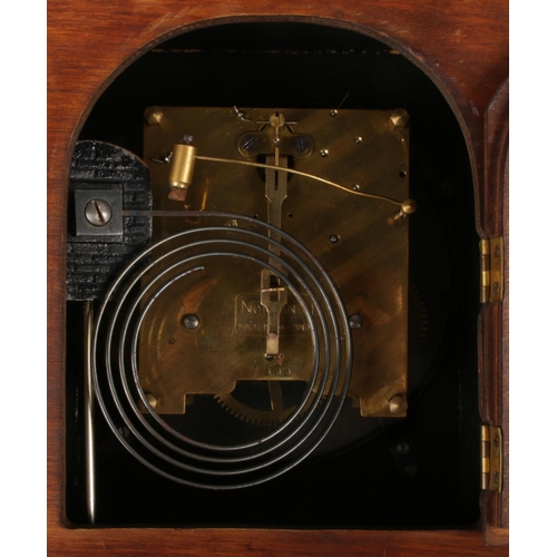 38 - Three oak cased mantel clocks. An Elliot oak cased 8 day mantel clock, Norland and a carved example ... 