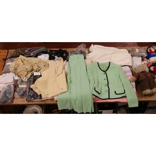 306 - Two boxes of lace, linen and vintage clothing along with a quantity of teddy bears.