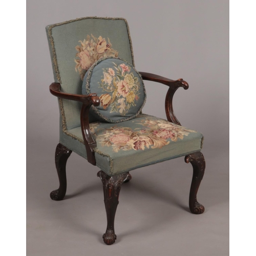 279 - A mahogany Gainsborough type armchair in 18th century style. With original woolwork upholstery and b... 