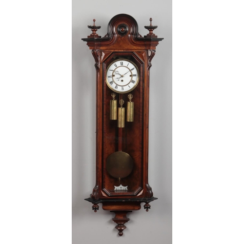 90 - A 19th century walnut cased Vienna wall clock by Gustav Becker. With ebonized mouldings and enamel d... 