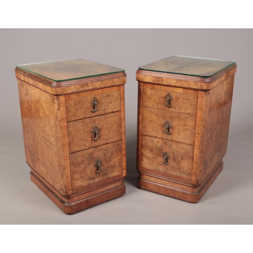 254 - A pair of Art Deco figured walnut three drawer bedside tables, 49cm x 38cm, 67cm high.