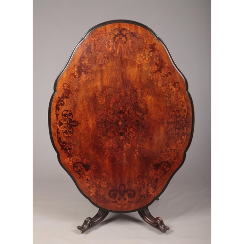 255 - A Victorian figured mahogany snap top centre table of scalloped lozenge form. With marquetry inlay, ... 