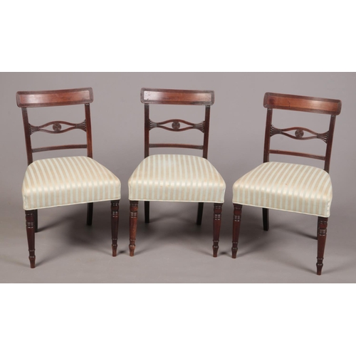 265 - A set of six Regency mahogany dining chairs. With reeded cresting rails supported on reeded uprights... 