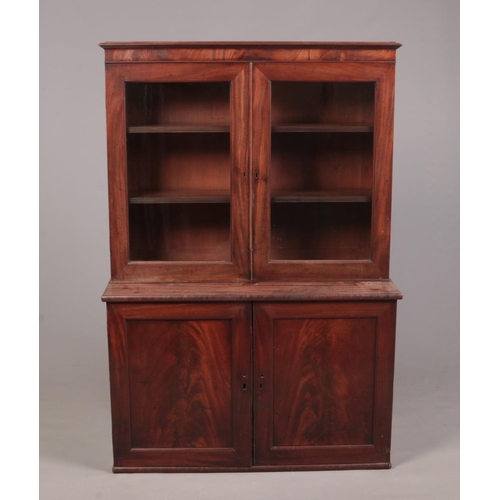 268 - A Regency mahogany dwarf bookcase on cupboard base, 150cm height 103cm width 42cm depth.