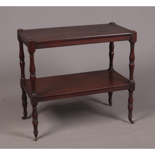 269 - A Regency mahogany two-tier buffet side table raised on turned supports.