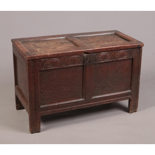 270 - A period oak coffer of small proportions with carved frieze, 96cm wide 48cm deep 63cm high.