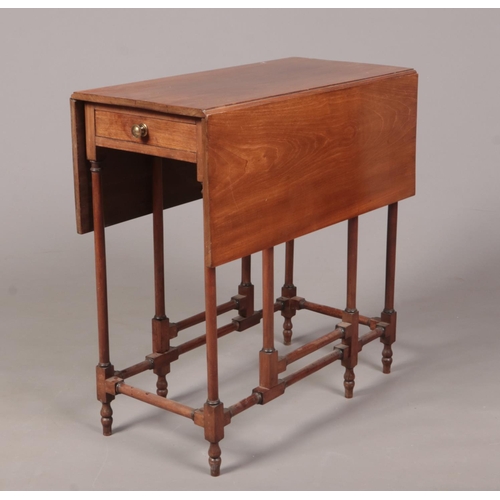 273 - A 19th century mahogany gateleg spider table with single drawer. With slender turned supports and cr... 