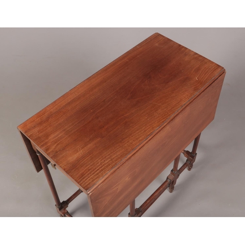 273 - A 19th century mahogany gateleg spider table with single drawer. With slender turned supports and cr... 