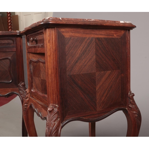 277 - A pair of early 20th century French kingwood and rosewood marble top pot cupboards. Each with a sing... 