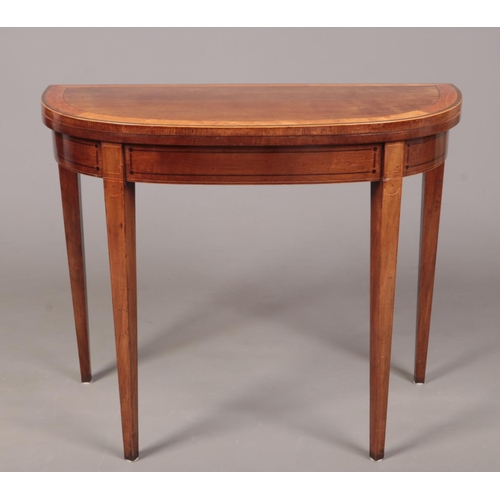 286 - A George III mahogany bow fronted card table raised on square tapering supports. Banded in satinwood... 