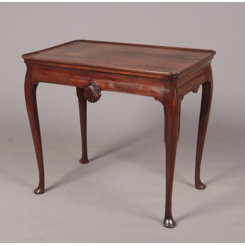 287 - A George II Irish mahogany silver table with notched rectangular dish top. With a pair of carved she... 