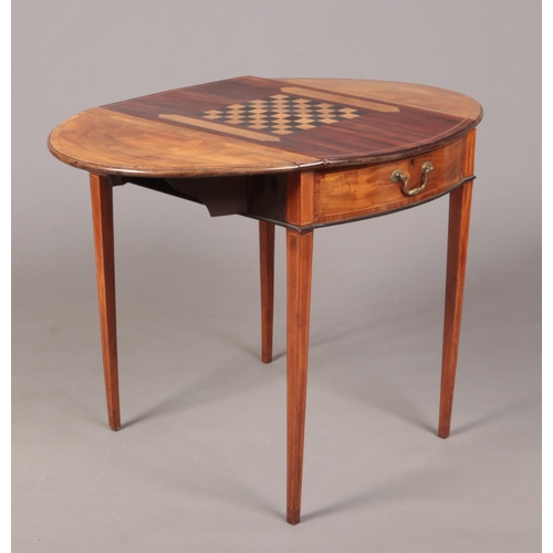 288 - A George III satinwood Pembroke games table. Crossbanded in mahogany, with strung inlay and raised o... 