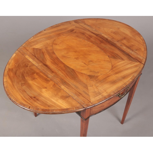 288 - A George III satinwood Pembroke games table. Crossbanded in mahogany, with strung inlay and raised o... 