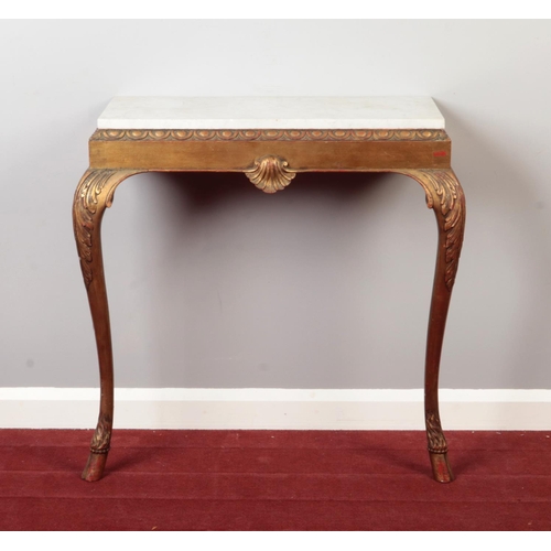 291 - A nineteenth century gilt wood marble top console table. On acanthus cabriole legs, terminating on h... 