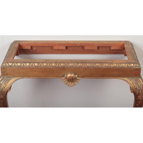 291 - A nineteenth century gilt wood marble top console table. On acanthus cabriole legs, terminating on h... 