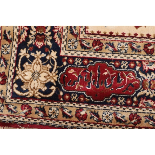 75 - Red ground Kashmir rug with a traditional hunting scene, 240 x 160cm.