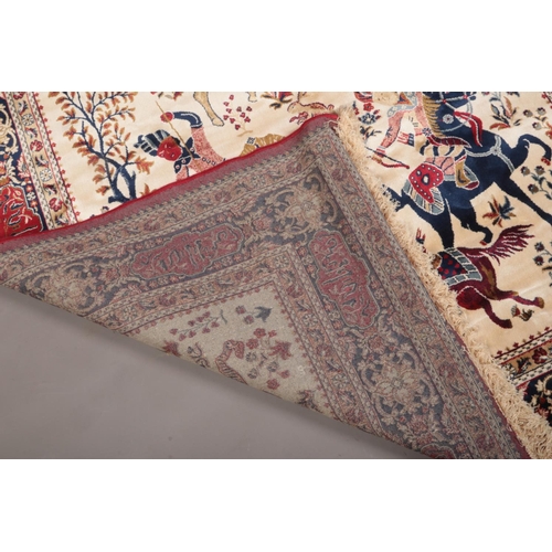 75 - Red ground Kashmir rug with a traditional hunting scene, 240 x 160cm.