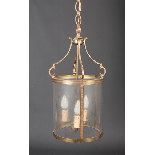 70 - A brass cylindrical three glass hall lantern with three branches and milled decoration, 56cm high, 2... 