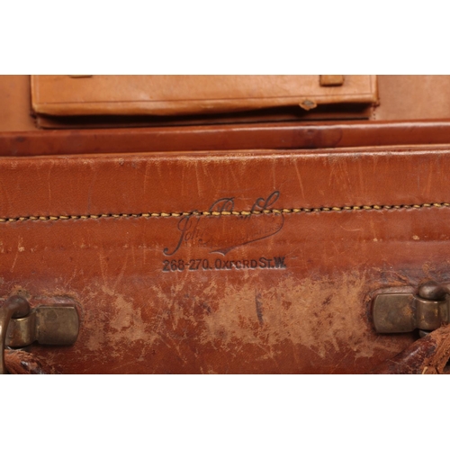 72 - A vintage tan leather fitted vanity case monogramed M. F. along with a quantity of sport / hunting t... 