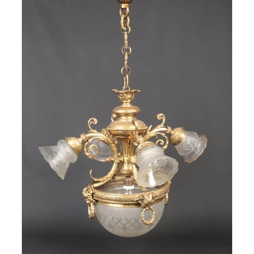 82 - A gilt metal five branch hanging light in Neo-Classical style. Ornamented with ram masks and husk sw... 