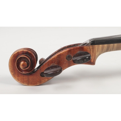 85 - A cased violin and bow. Label for John Betts, Royal Exchange. Stamped to the reverse underneath the ... 