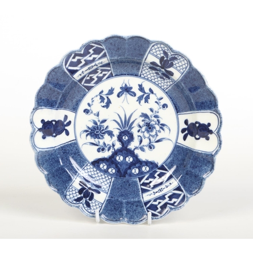 91 - A Caughley uncommon lobed plate. Painted in underglaze blue with the Scholar's Rock pattern. C mark ... 