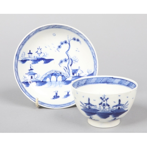 97 - a Caughley teabowl and saucer. Painted in underglaze blue with the Bridge and Windmill pattern c.178... 