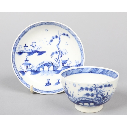 97 - a Caughley teabowl and saucer. Painted in underglaze blue with the Bridge and Windmill pattern c.178... 