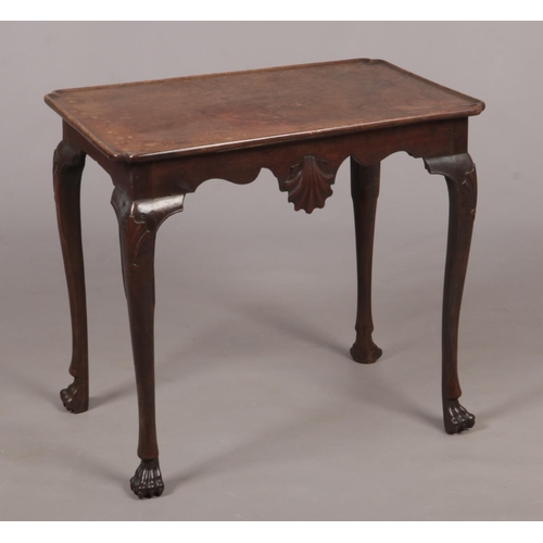 280 - A Irish George II mahogany notched dish top silver table. With shell motifs to the front and rear fr... 