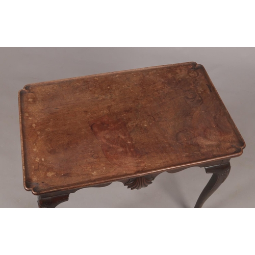 280 - A Irish George II mahogany notched dish top silver table. With shell motifs to the front and rear fr... 