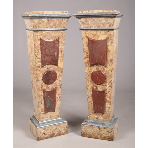 283 - A pair of 19th century variegated rouge marble torcheres of square tapering form, 123cm.