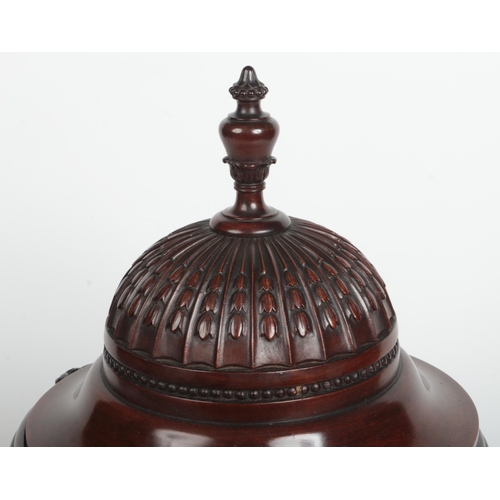 77 - A pair of Neo-Classical style mahogany fitted knife boxes of urn form. With carved ram masks and hus... 