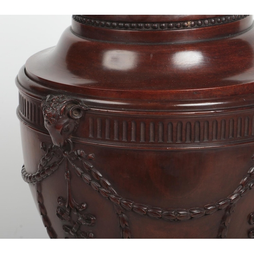 77 - A pair of Neo-Classical style mahogany fitted knife boxes of urn form. With carved ram masks and hus... 