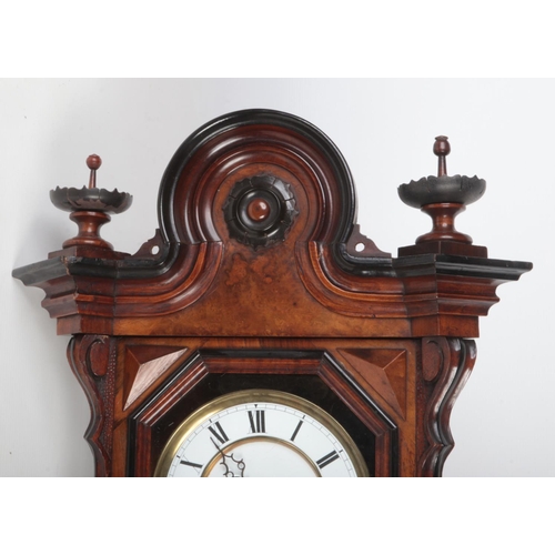 90 - A 19th century walnut cased Vienna wall clock by Gustav Becker. With ebonized mouldings and enamel d... 